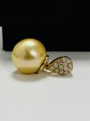 14ct Yellow Gold Pearl and Diamond pendant featuring, golden South Sea Pearl, with 13 round brillian