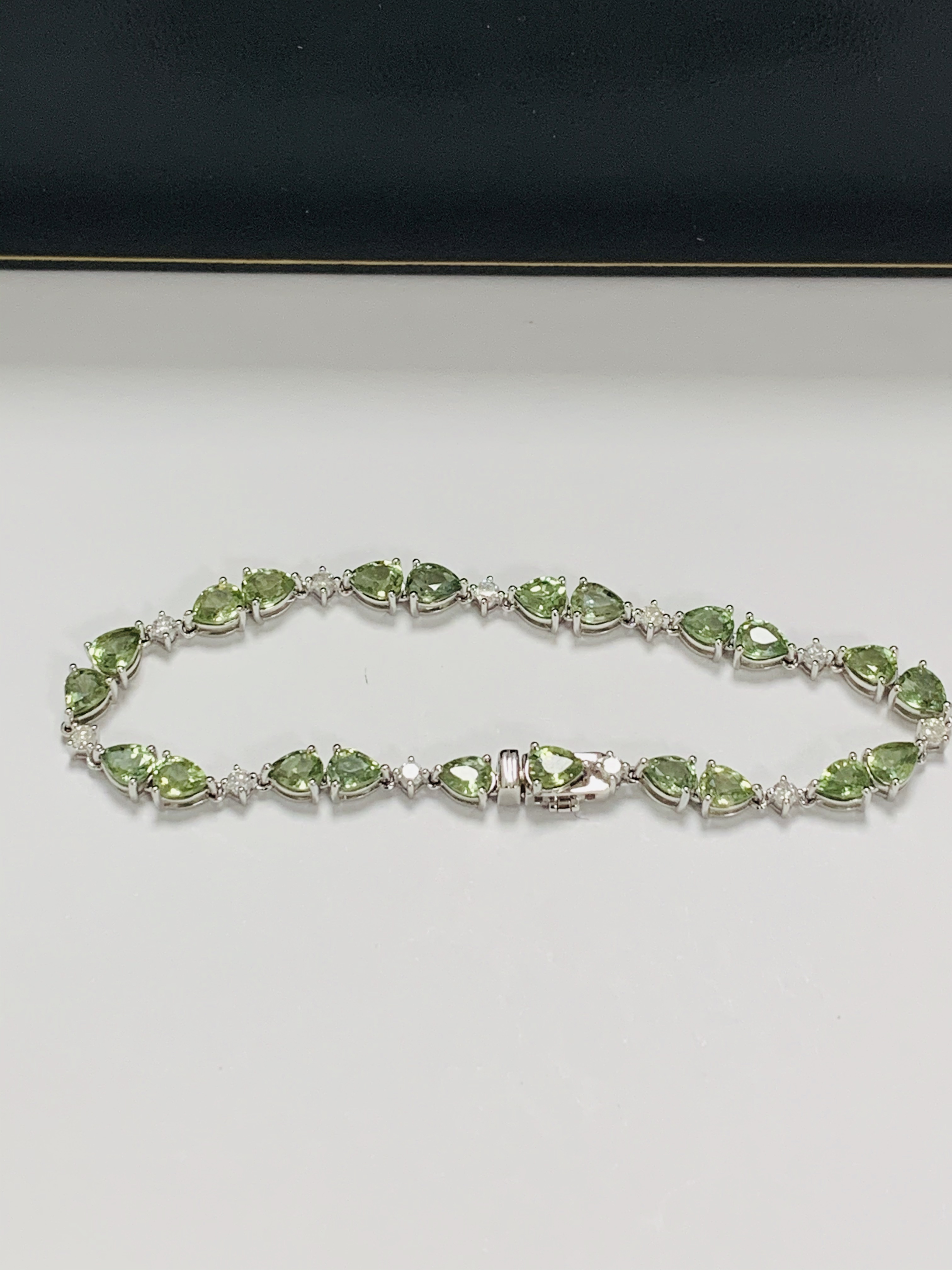 14ct White Gold Sapphire and Diamond bracelet featuring, 22 pear cut, light green Sapphires (9.05ct