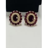 14ct Rose Gold Ruby and Diamond stud earrings featuring, 2 oval cut Rubies (1.47ct TSW), claw set, w