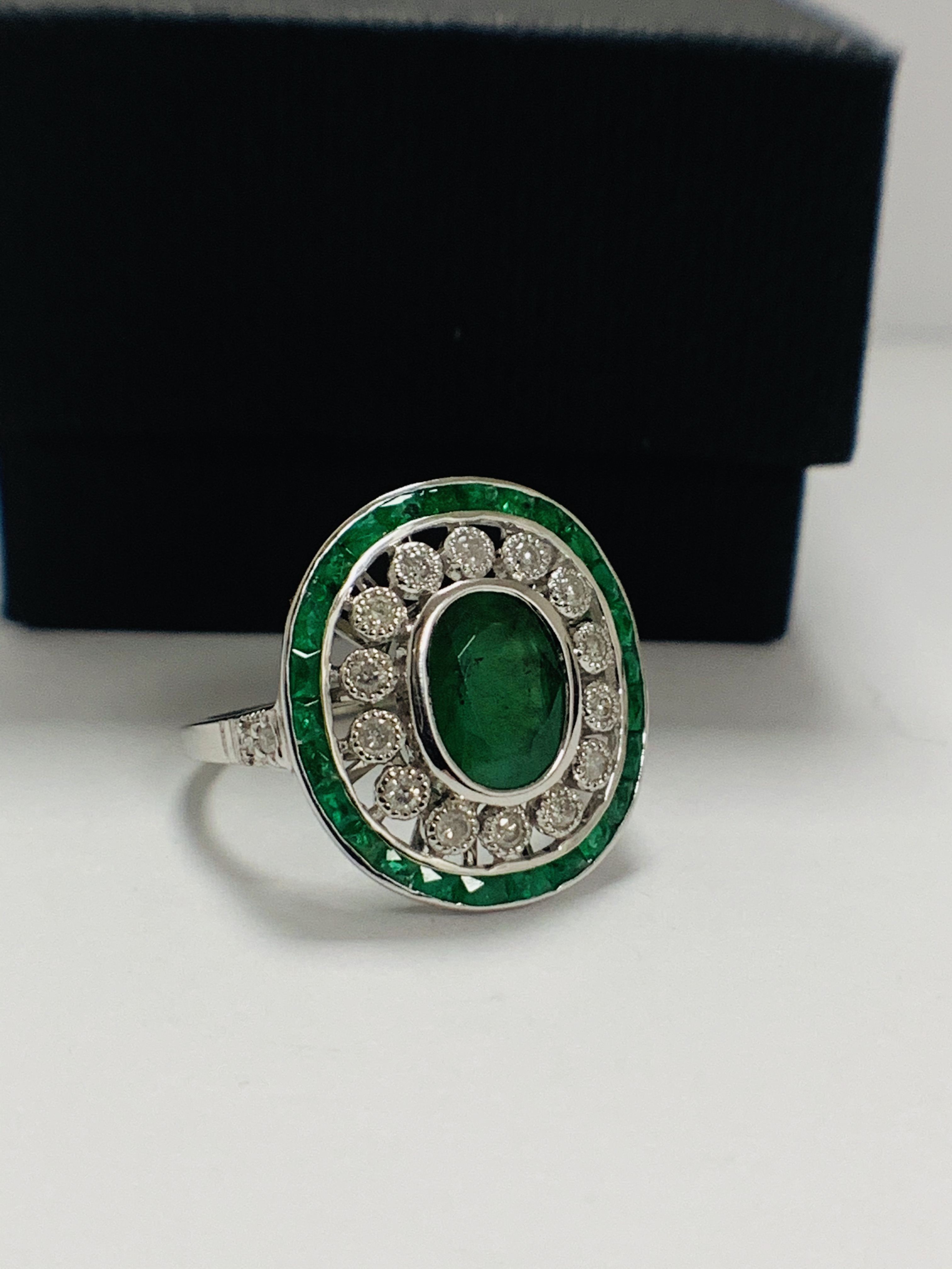 18ct White Gold Emerald and Diamond ring featuring centre, oval cut, green Emerald (2.06ct), claw se - Image 8 of 11