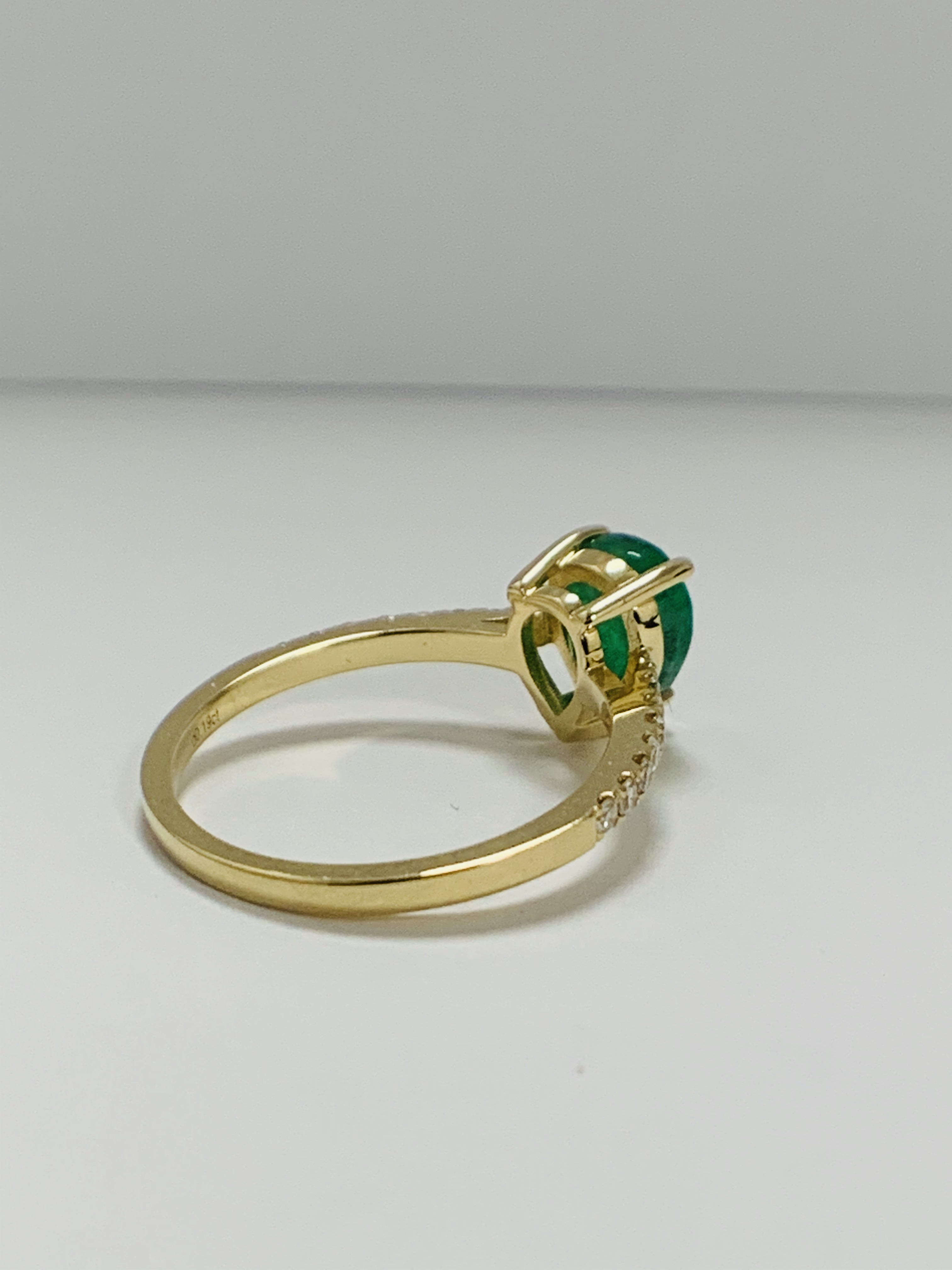 14ct Yellow Gold Emerald and Diamond ring featuring centre, pear cut, medium green Emerald (1.23ct), - Image 4 of 10