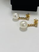 14ct Yellow Gold Pearl and Diamond earrings featuring, 2 white Pearls, with 8 round brilliant cut Di