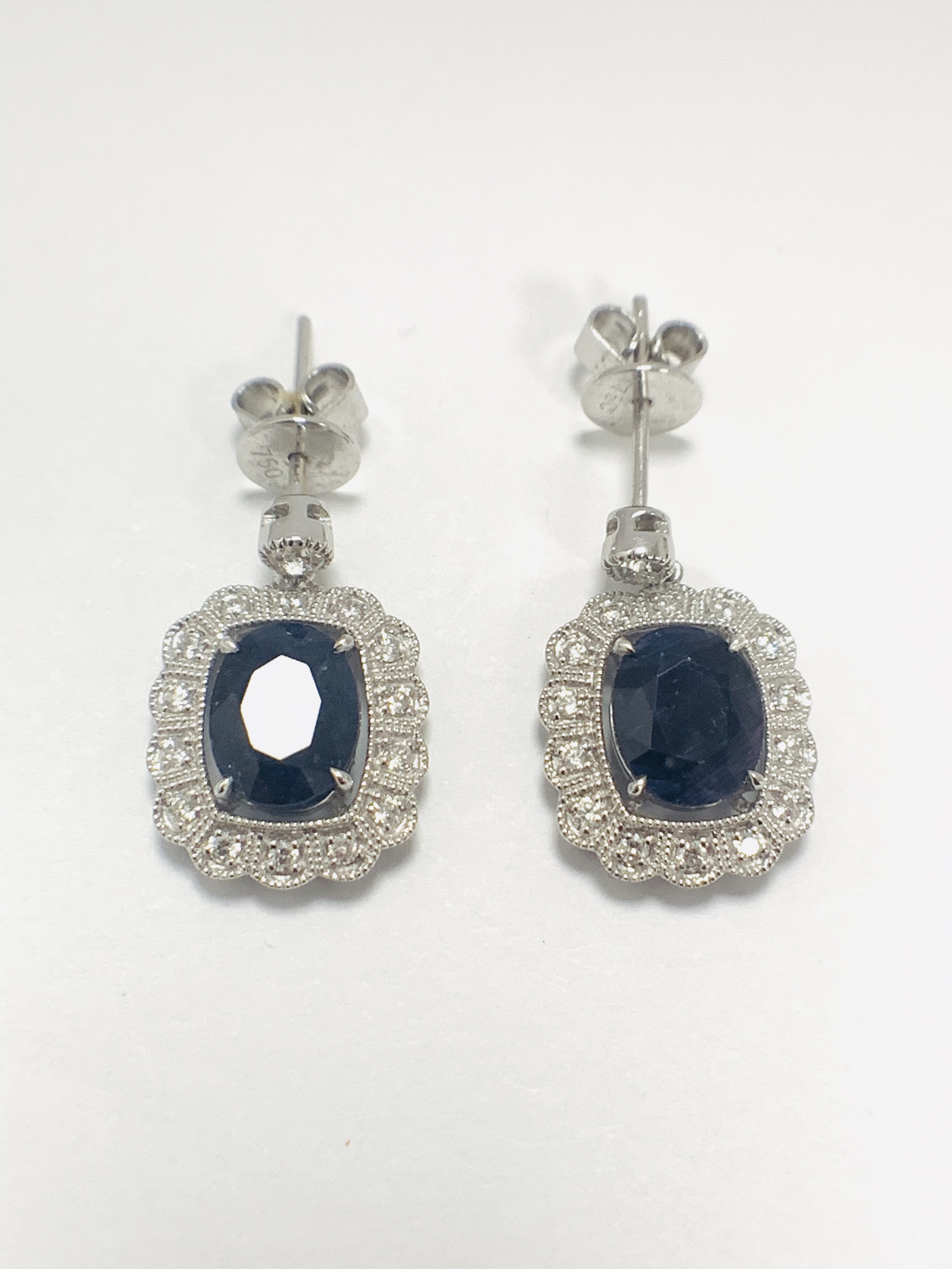 18ct White Gold Sapphire and Diamond earrings featiring, 2 oval cut, dark blue Kashmir Sapphires (4.