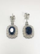 18ct White Gold Sapphire and Diamond earrings featiring, 2 oval cut, dark blue Kashmir Sapphires (4.