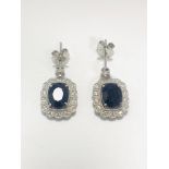 18ct White Gold Sapphire and Diamond earrings featiring, 2 oval cut, dark blue Kashmir Sapphires (4.