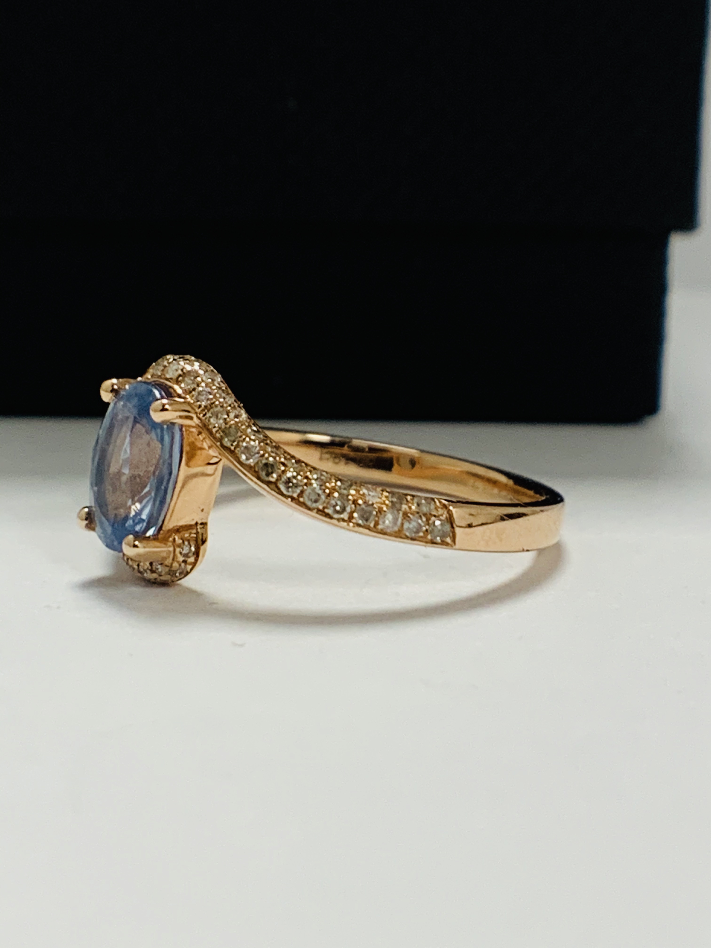 14ct Rose Gold Sapphire and Diamond ring featuring centre, oval cut, blue Sapphire (1.10ct), claw se - Image 3 of 13