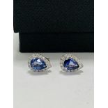 14ct White Gold Sapphire and Diamond earrings featuring centre, 2 pear cut, medium blue Sapphire (1.