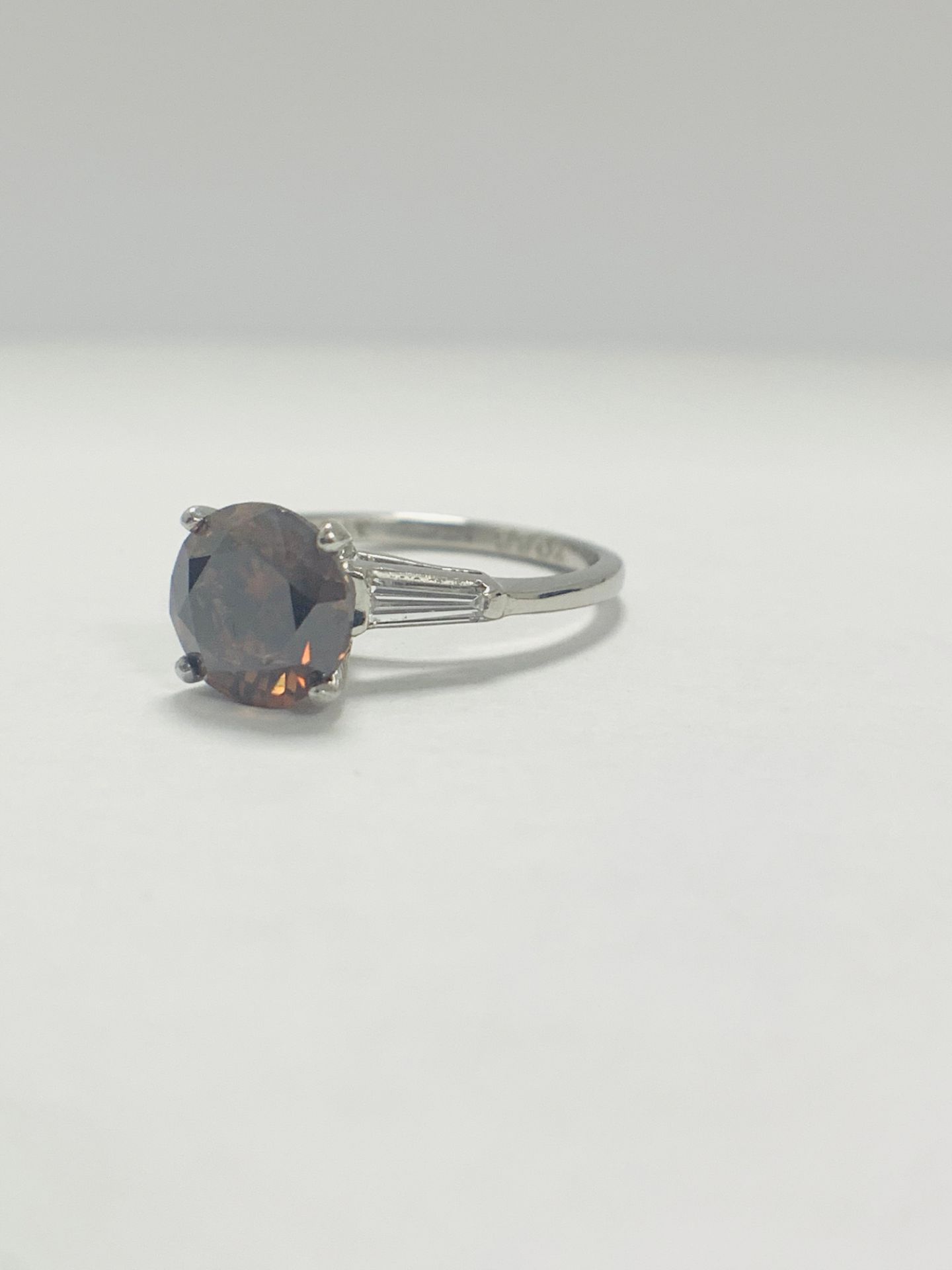 Platinum Diamond ring featuring centre, round brilliant cut, deep orangey brown Diamond (2.15ct) - Image 3 of 14