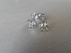 0.80Ct Diamond Solitaire Stud Earrings Set In Platinum.