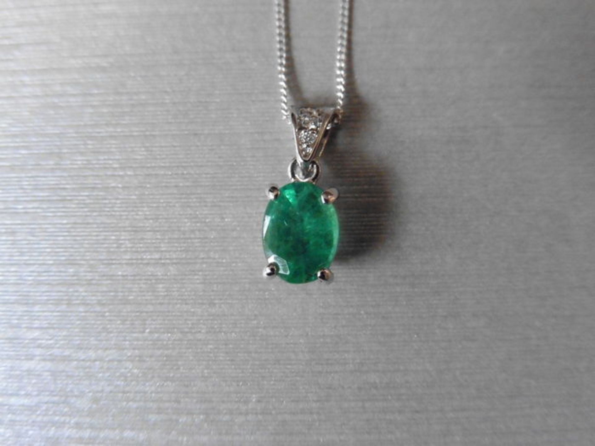 1.60Ct Emerald And Diamond Pendant With An 8X6Mm Oval Cut Emerald ( Oil Treated ) And A Diamond Set