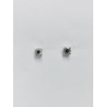 0.50Ct Diamond Solitaire Stud Earrings Set In Platinum.