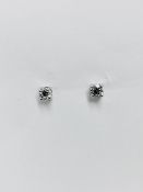 0.50Ct Diamond Solitaire Stud Earrings Set In Platinum.