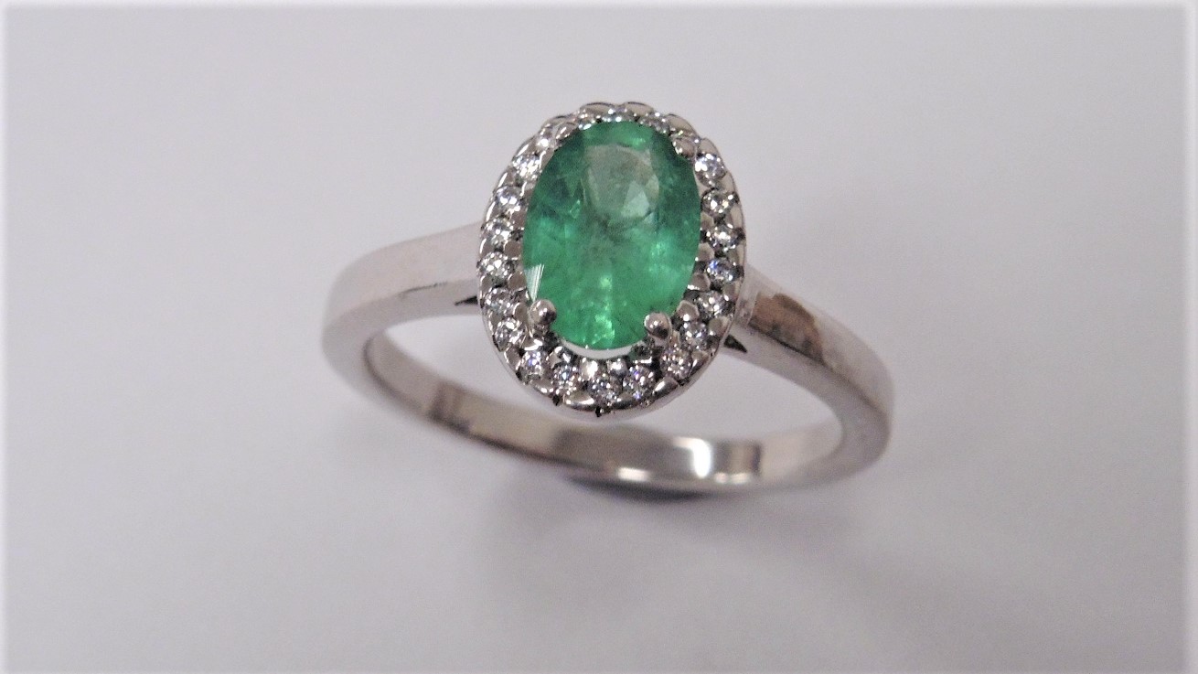 Emerald And Diamond Cluster Ring Set In Platinum.