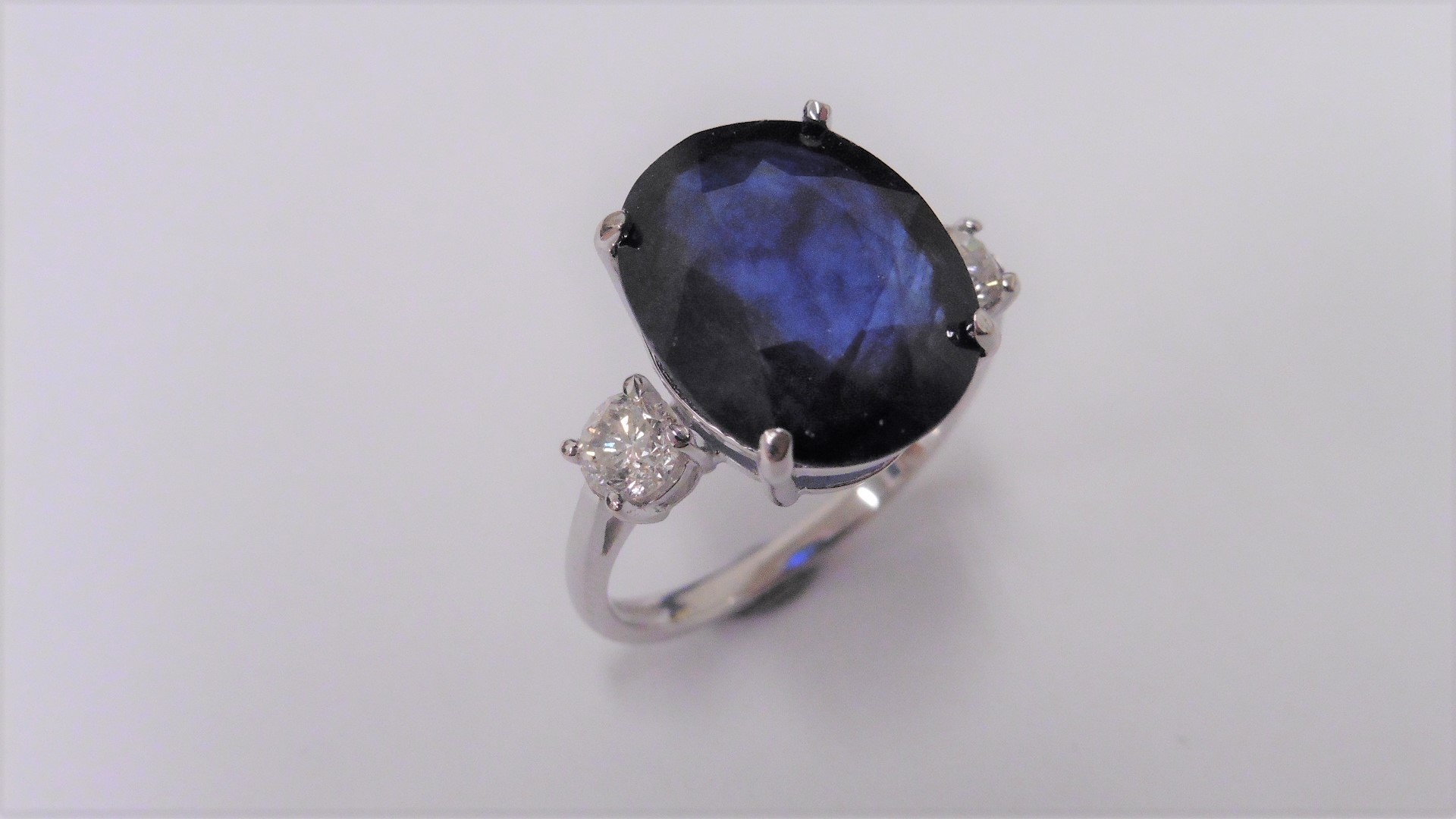 9Ct Sapphire And Diamond Trilogy Ring Set In Platinum.