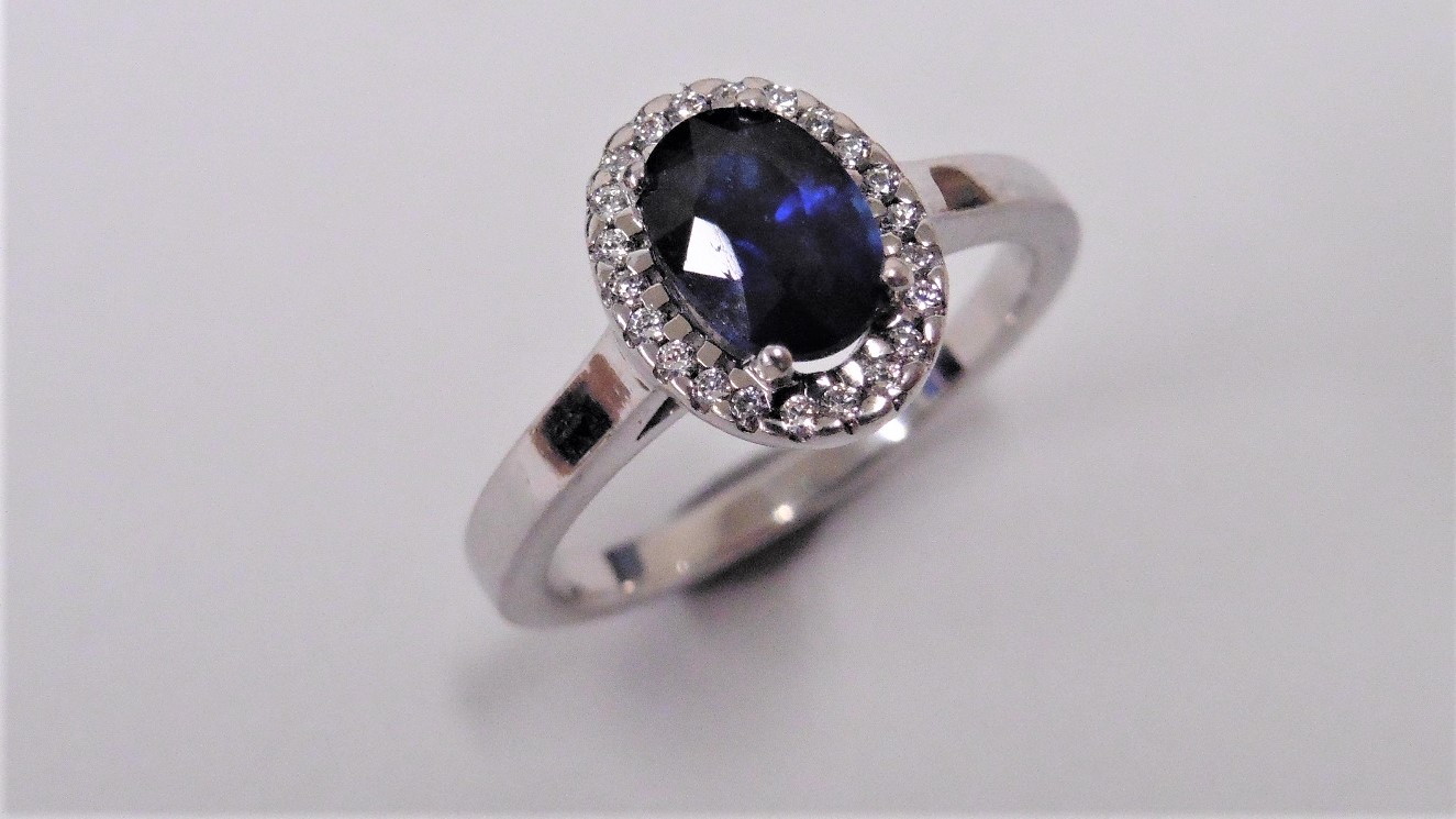 Sapphire And Diamond Cluster Ring Set In Platinum.