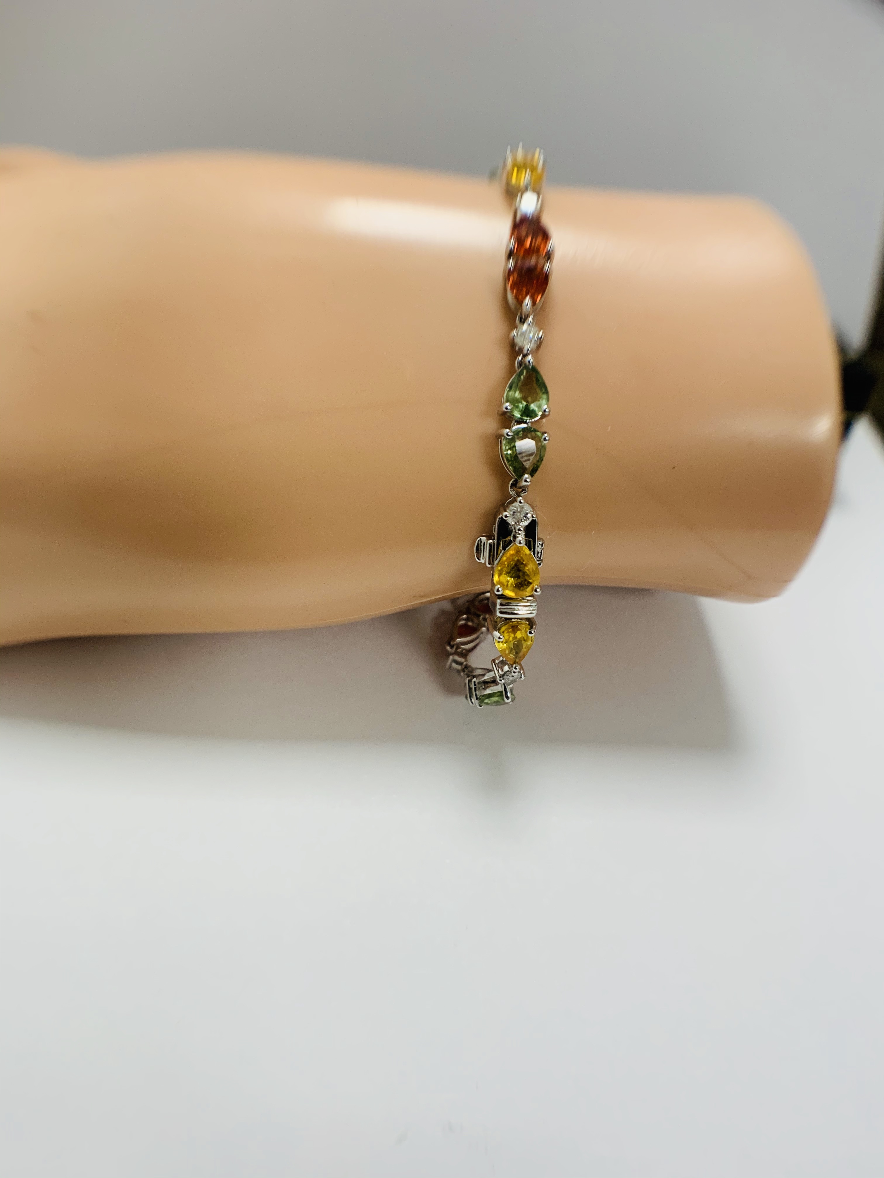 14ct White Gold Sapphire and Diamond bracelet featuring, 22 pear cut, yellow, green and orange Sapph - Image 22 of 24