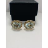 14ct Yellow Gold Aquamarine and Diamond stud earrings featuring, 2 oval cut Aquamarines (8.22ct TSW)