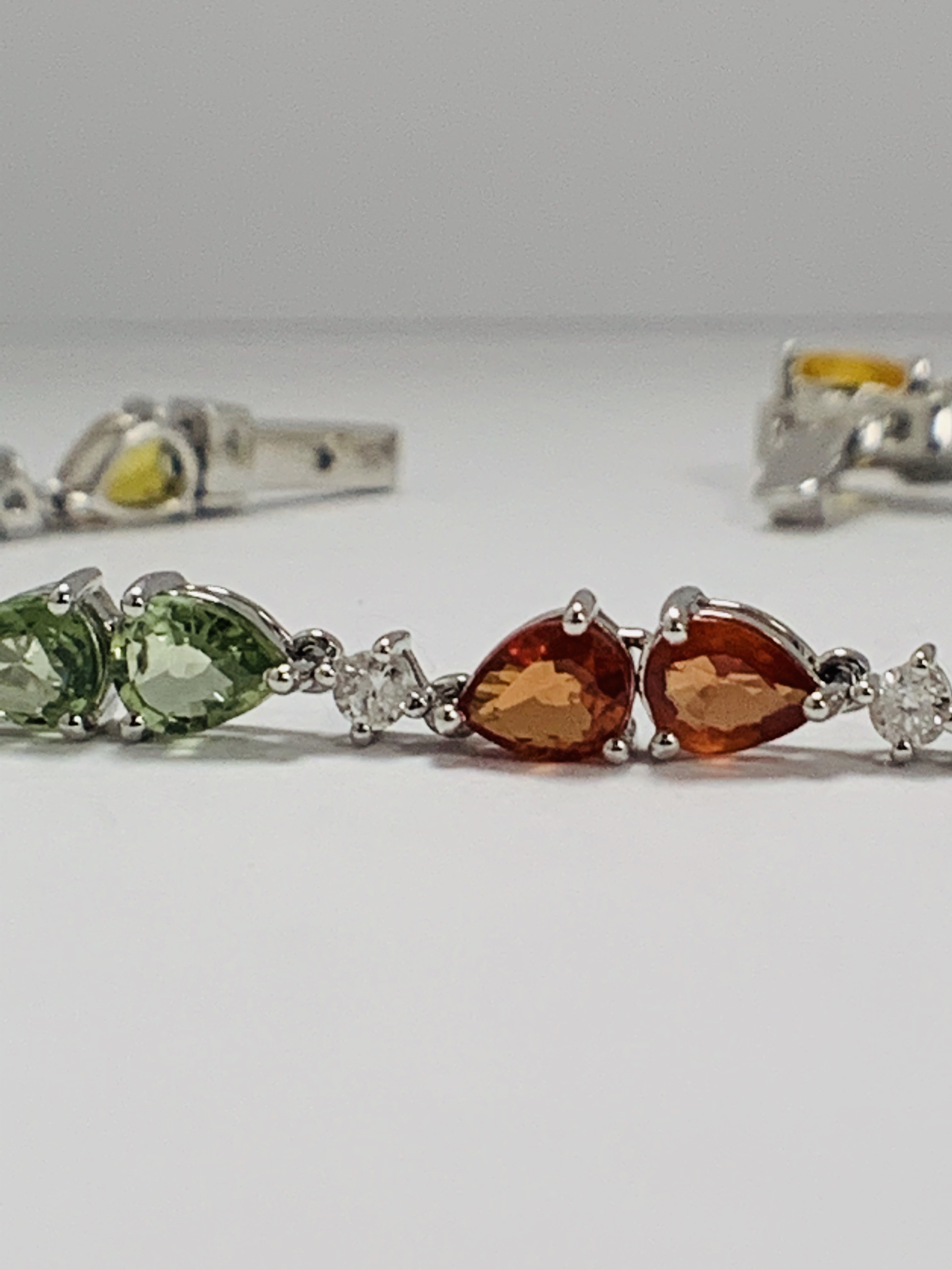14ct White Gold Sapphire and Diamond bracelet featuring, 22 pear cut, yellow, green and orange Sapph - Image 2 of 24
