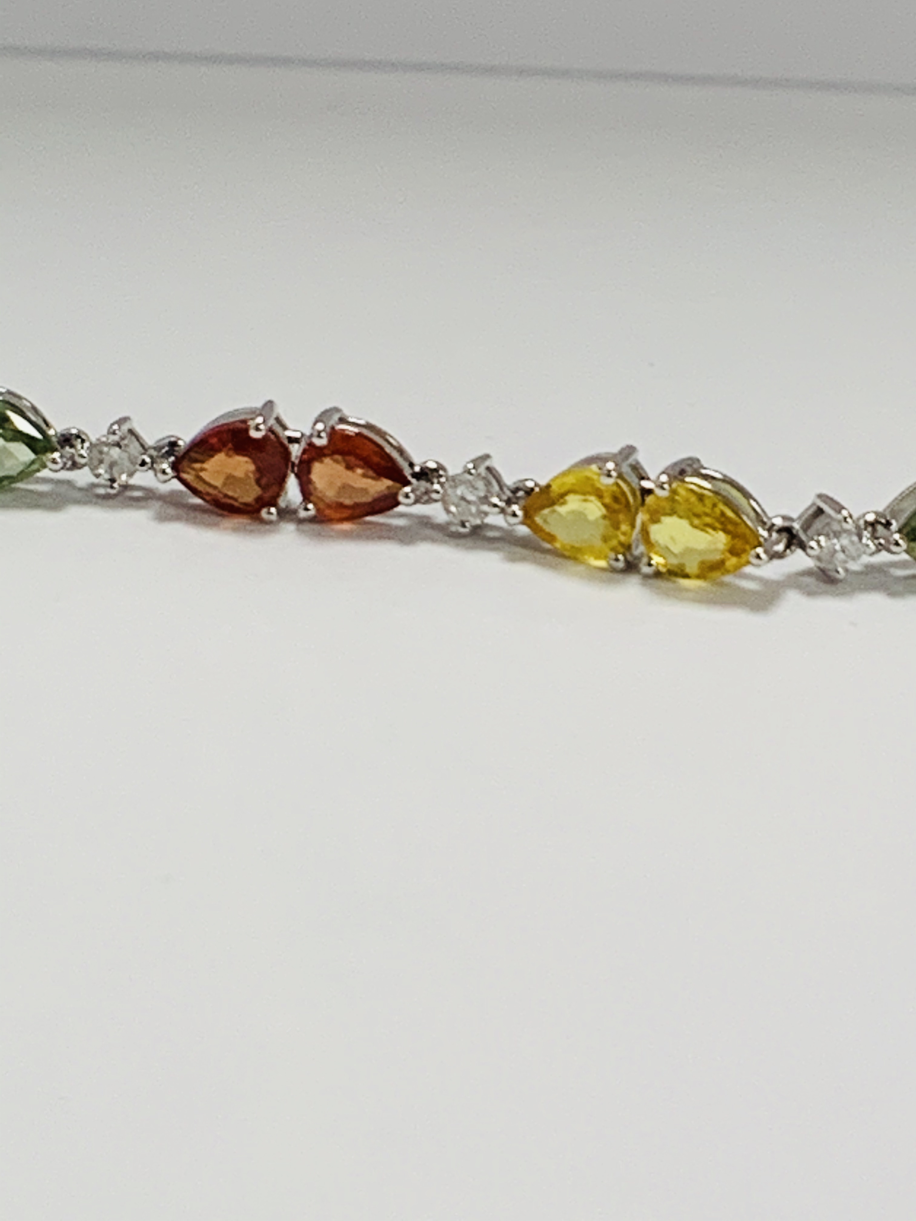 14ct White Gold Sapphire and Diamond bracelet featuring, 22 pear cut, yellow, green and orange Sapph - Image 7 of 24