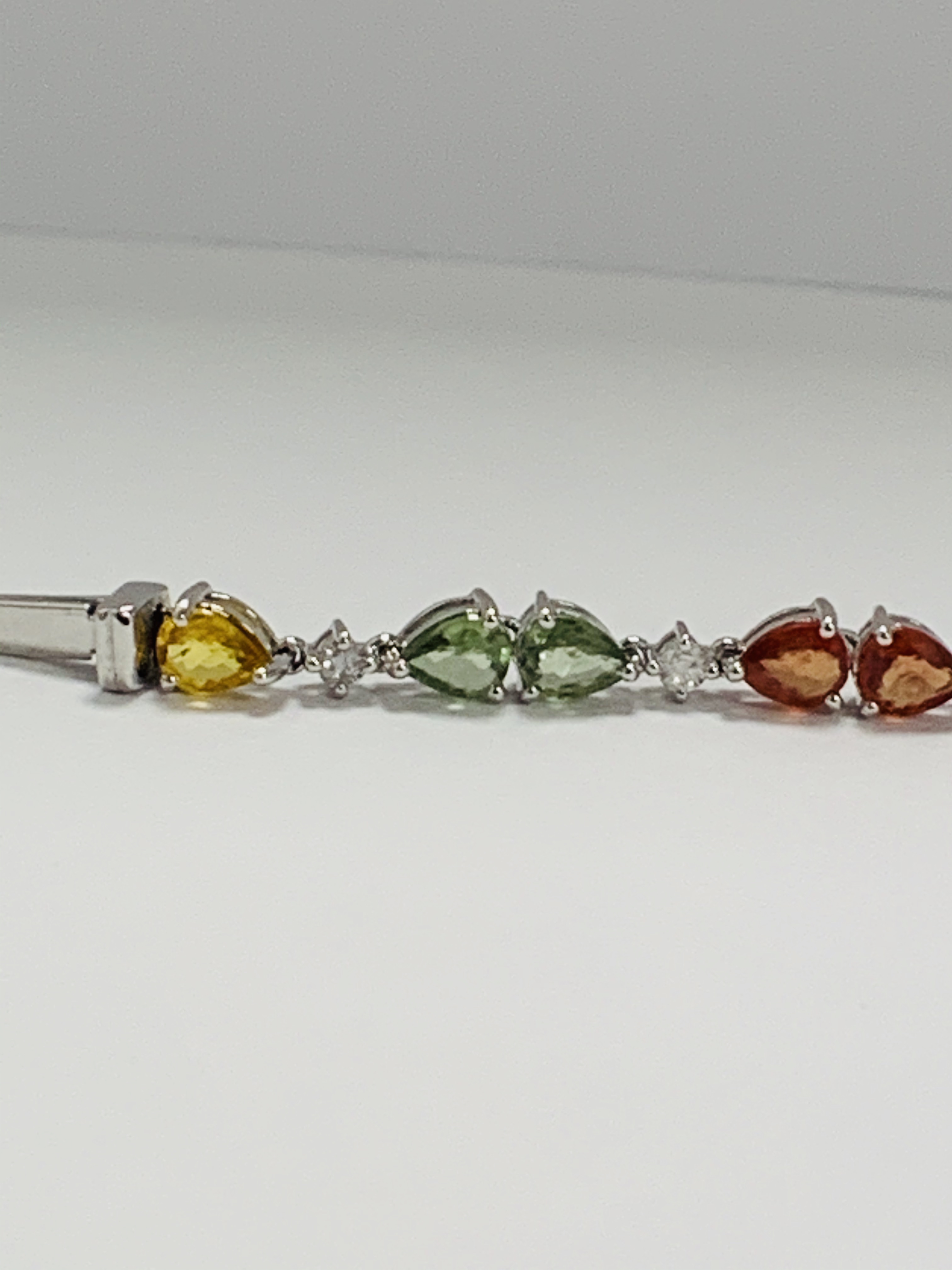 14ct White Gold Sapphire and Diamond bracelet featuring, 22 pear cut, yellow, green and orange Sapph - Image 5 of 24