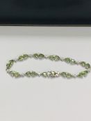 14ct White Gold Sapphire and Diamond bracelet featuring, 22 pear cut, light green Sapphires (9.05ct