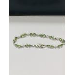 14ct White Gold Sapphire and Diamond bracelet featuring, 22 pear cut, light green Sapphires (9.05ct