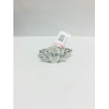 1ct Oval Diamond Trilogy style ring set in platinum