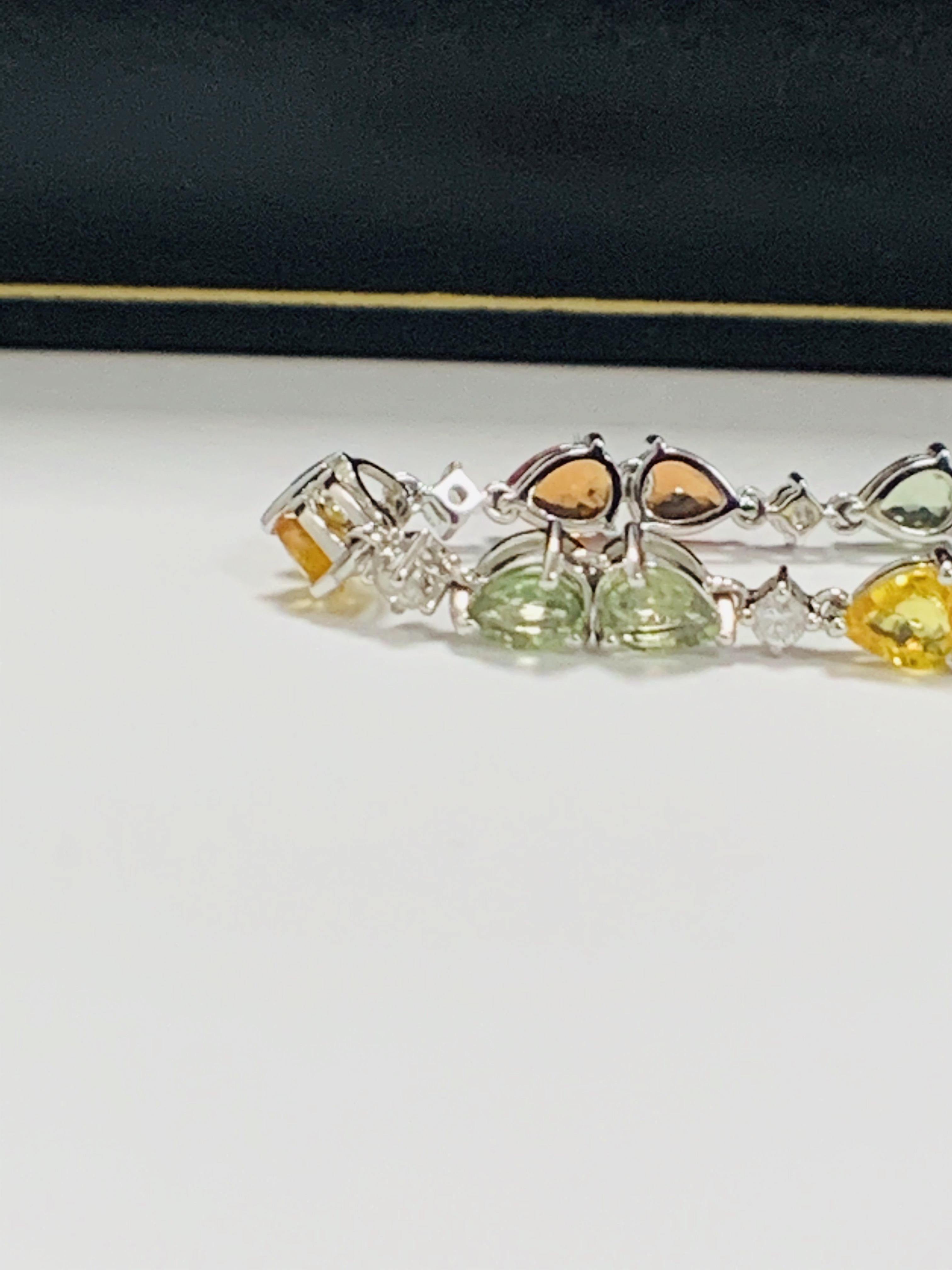 14ct White Gold Sapphire and Diamond bracelet featuring, 22 pear cut, yellow, green and orange Sapph - Image 15 of 24