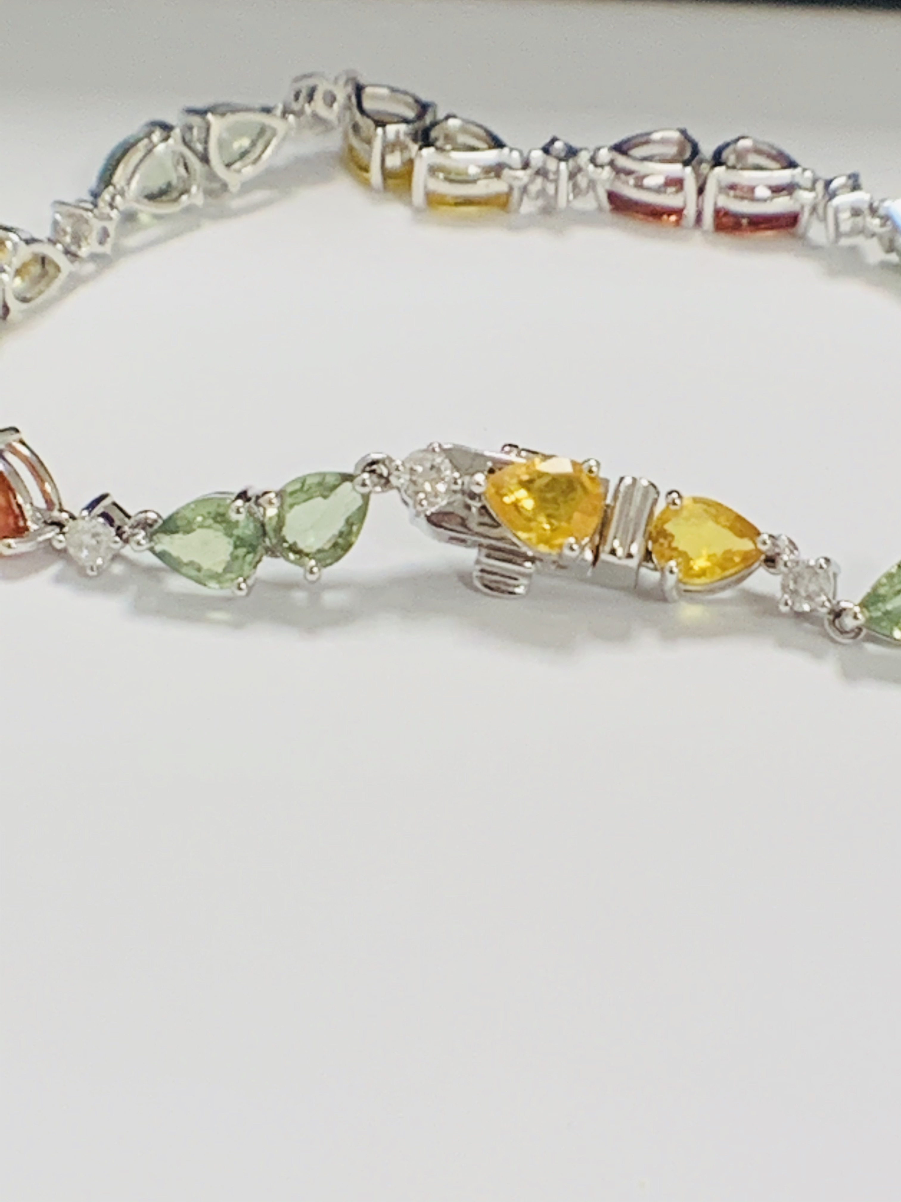 14ct White Gold Sapphire and Diamond bracelet featuring, 22 pear cut, yellow, green and orange Sapph - Image 18 of 24