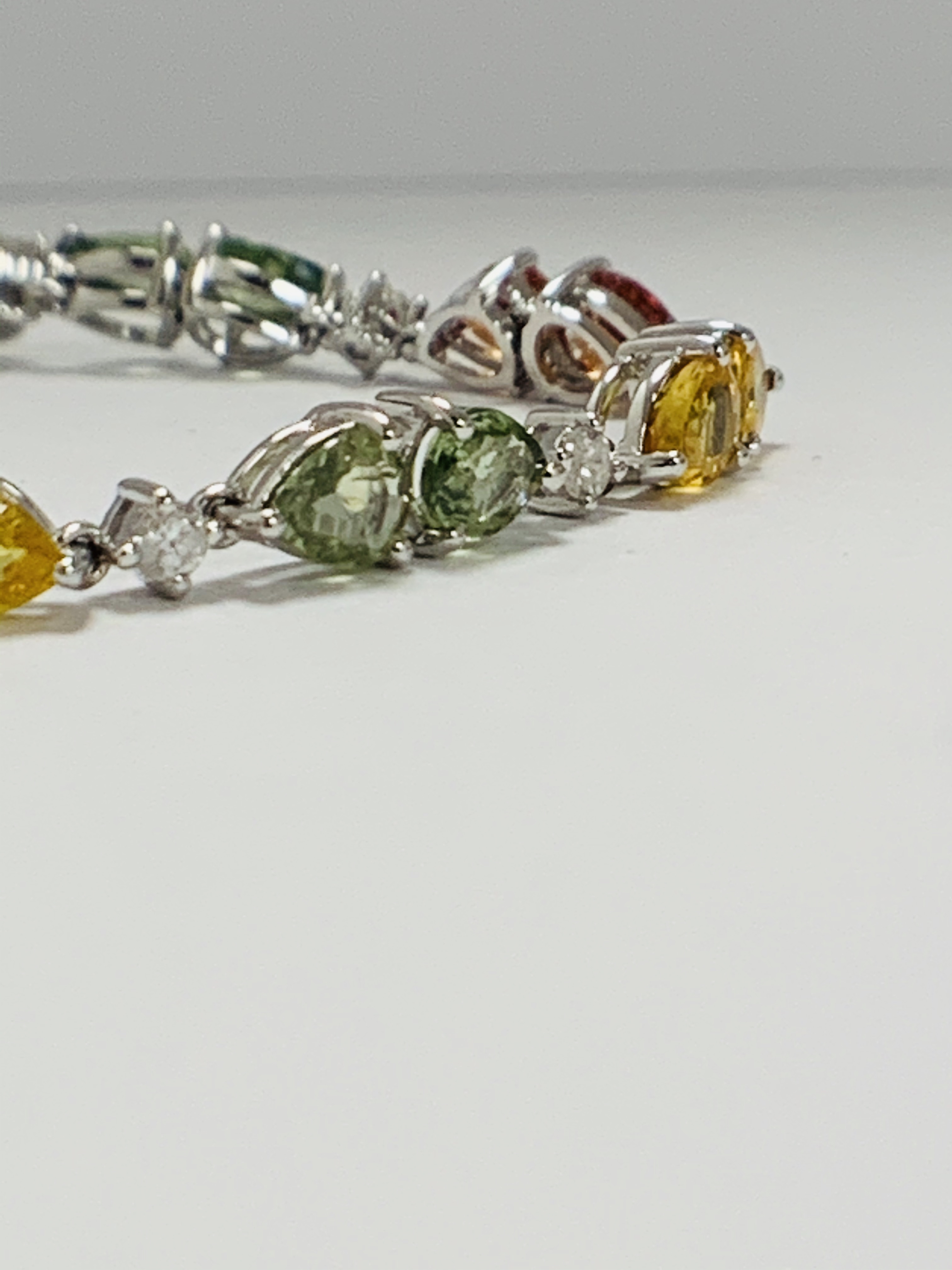 14ct White Gold Sapphire and Diamond bracelet featuring, 22 pear cut, yellow, green and orange Sapph - Image 4 of 24