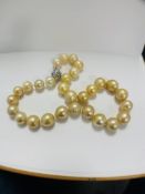 Pearl and Diamond necklace strand featuring, 33 South Sea Pearls, with 4 round brilliant cut Diamond