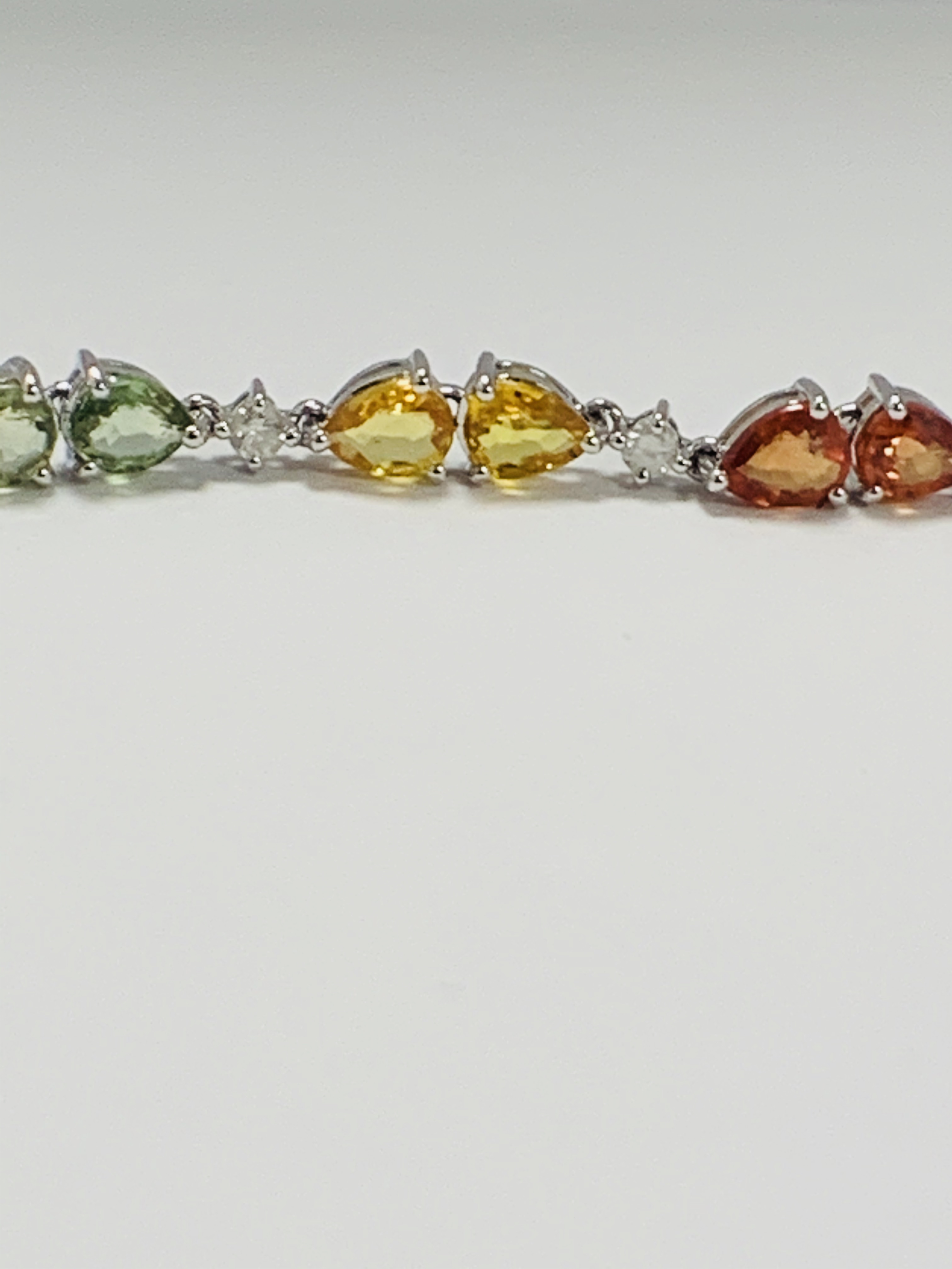 14ct White Gold Sapphire and Diamond bracelet featuring, 22 pear cut, yellow, green and orange Sapph - Image 8 of 24