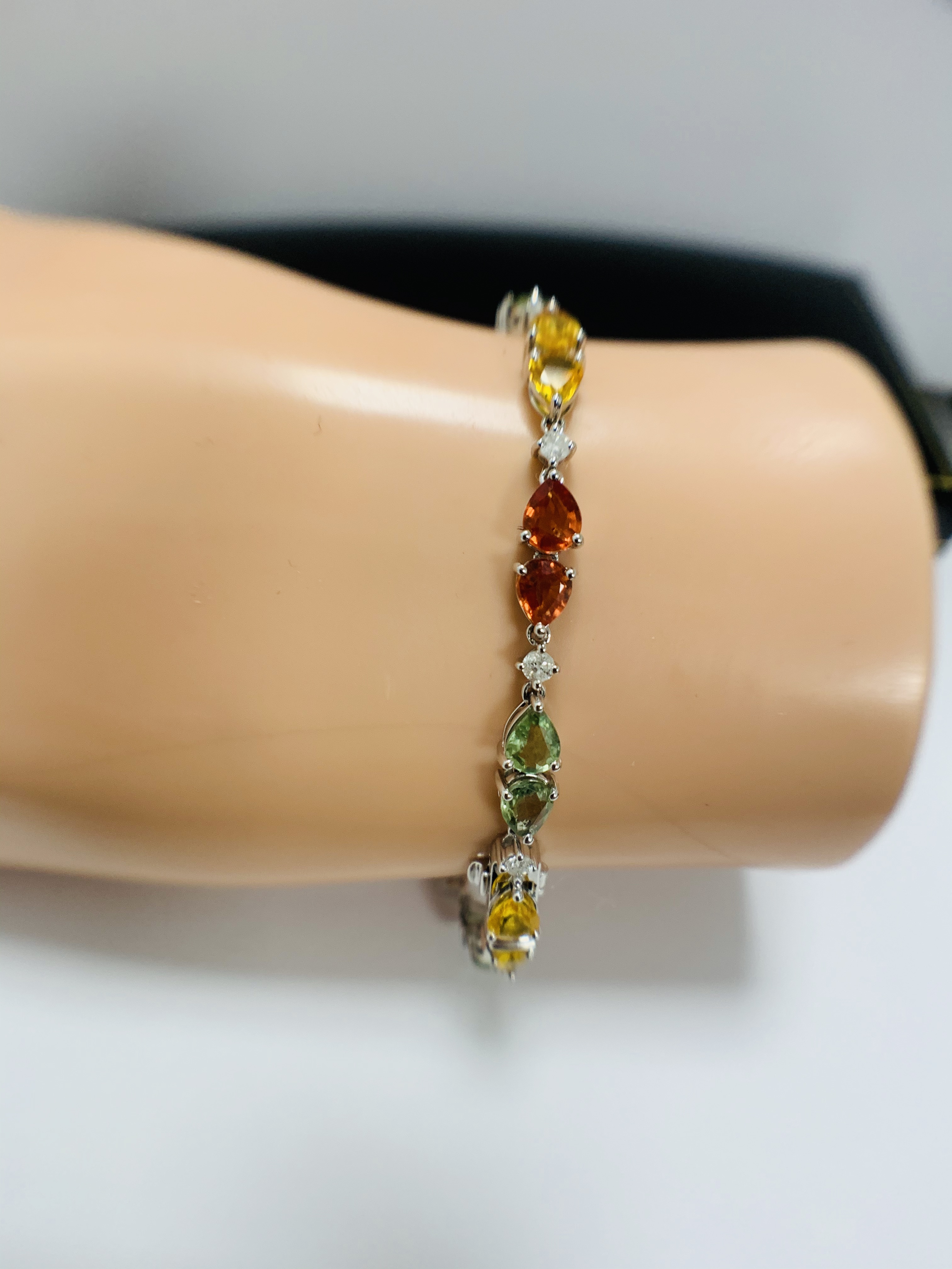 14ct White Gold Sapphire and Diamond bracelet featuring, 22 pear cut, yellow, green and orange Sapph - Image 21 of 24