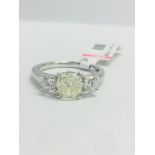 1t Cushion cut diamond Trilogy ring set in a platinum setting