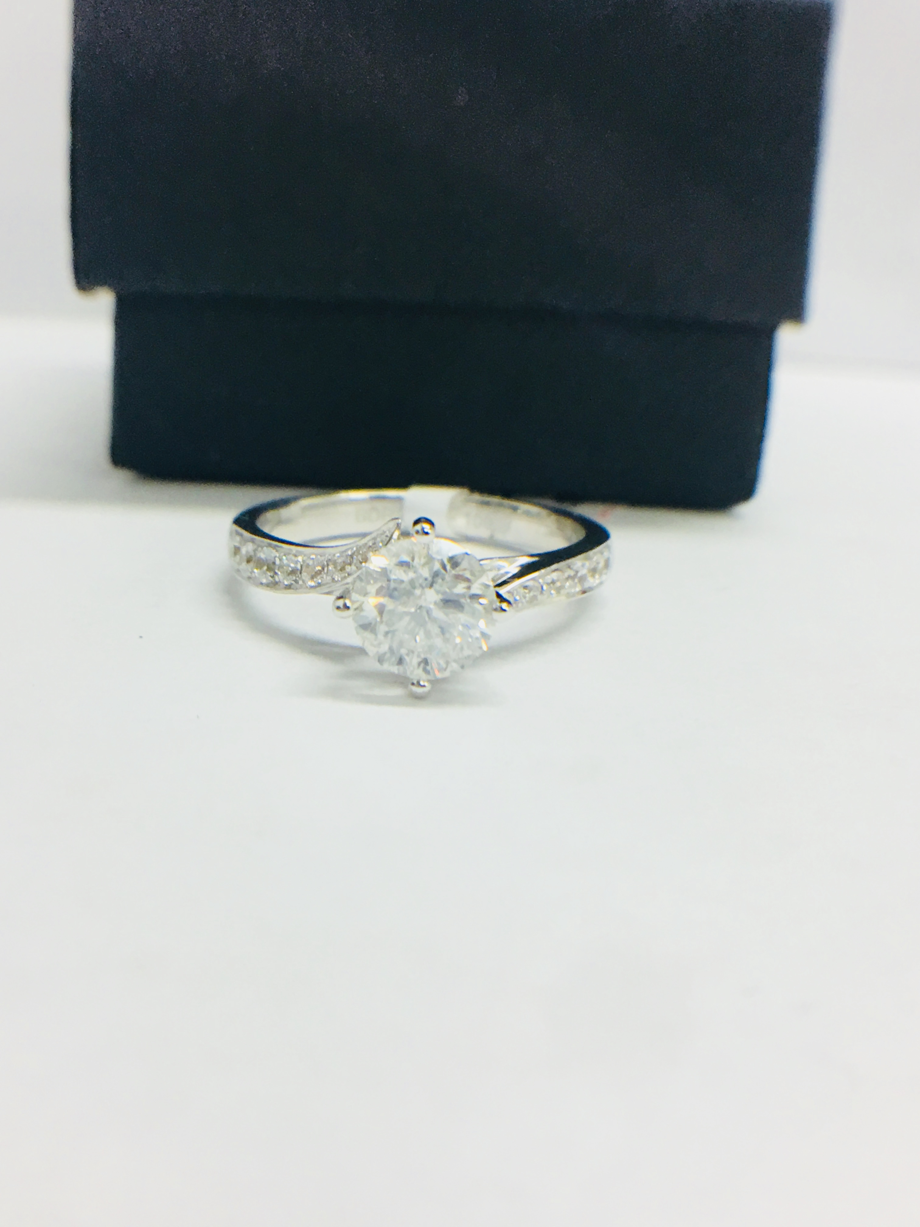 1ct Brilliant cut Diamond set in a diamond set platinum mount