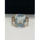 14ct Yellow Gold Aquamarine and Diamond ring featuring centre, cushion cut Aquamarine (5.25ct), claw