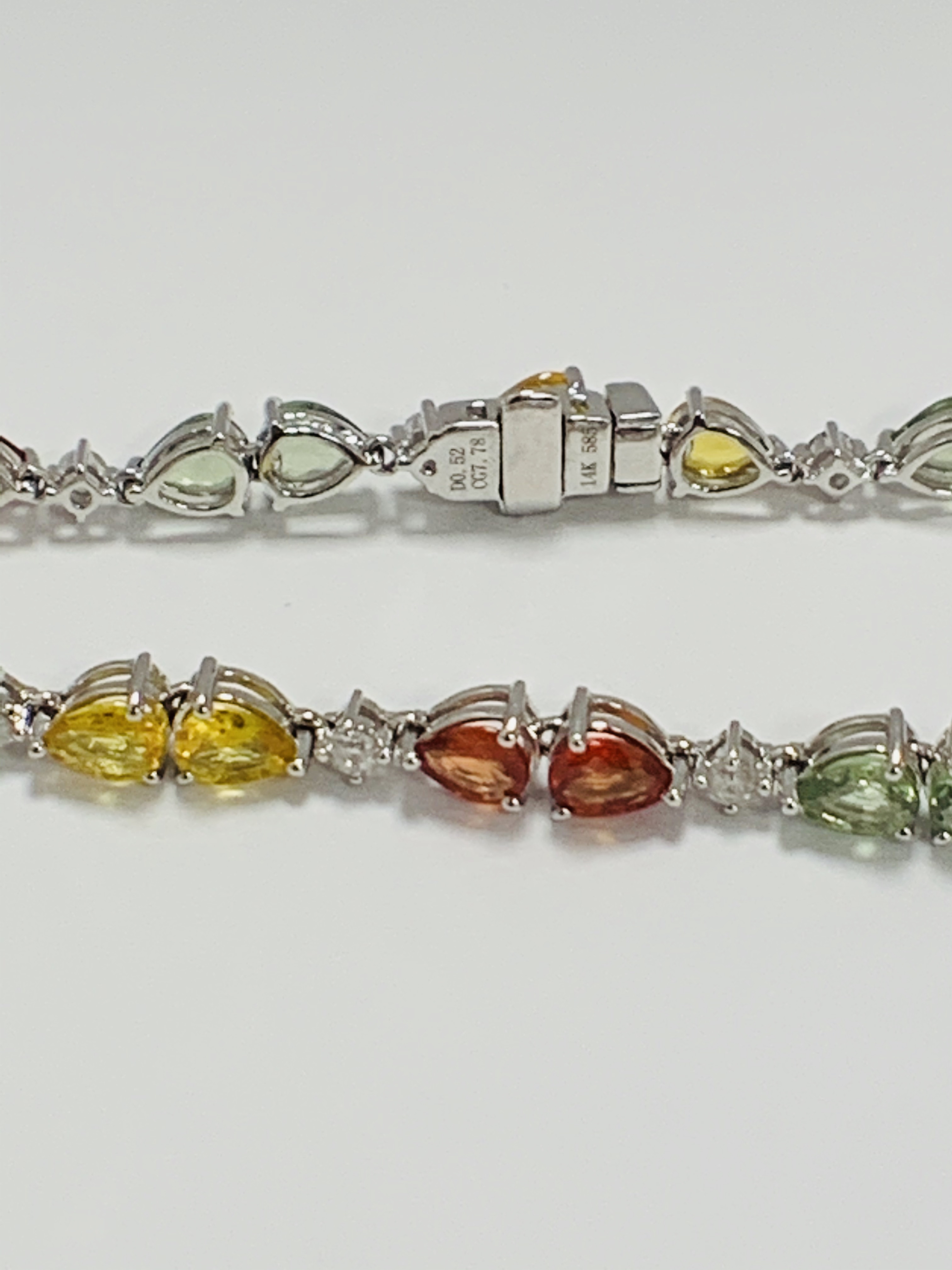 14ct White Gold Sapphire and Diamond bracelet featuring, 22 pear cut, yellow, green and orange Sapph - Image 12 of 24