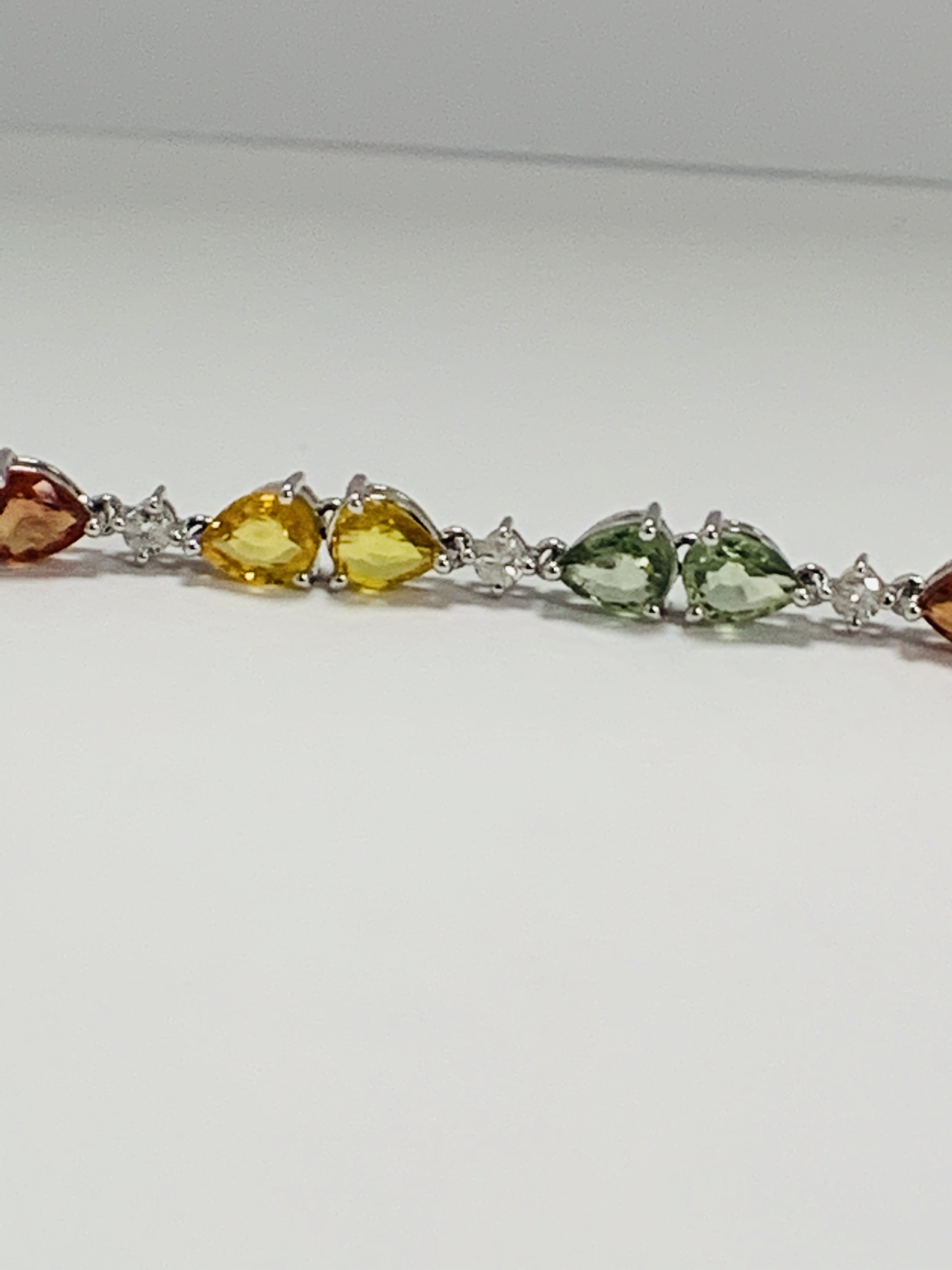 14ct White Gold Sapphire and Diamond bracelet featuring, 22 pear cut, yellow, green and orange Sapph - Image 6 of 24