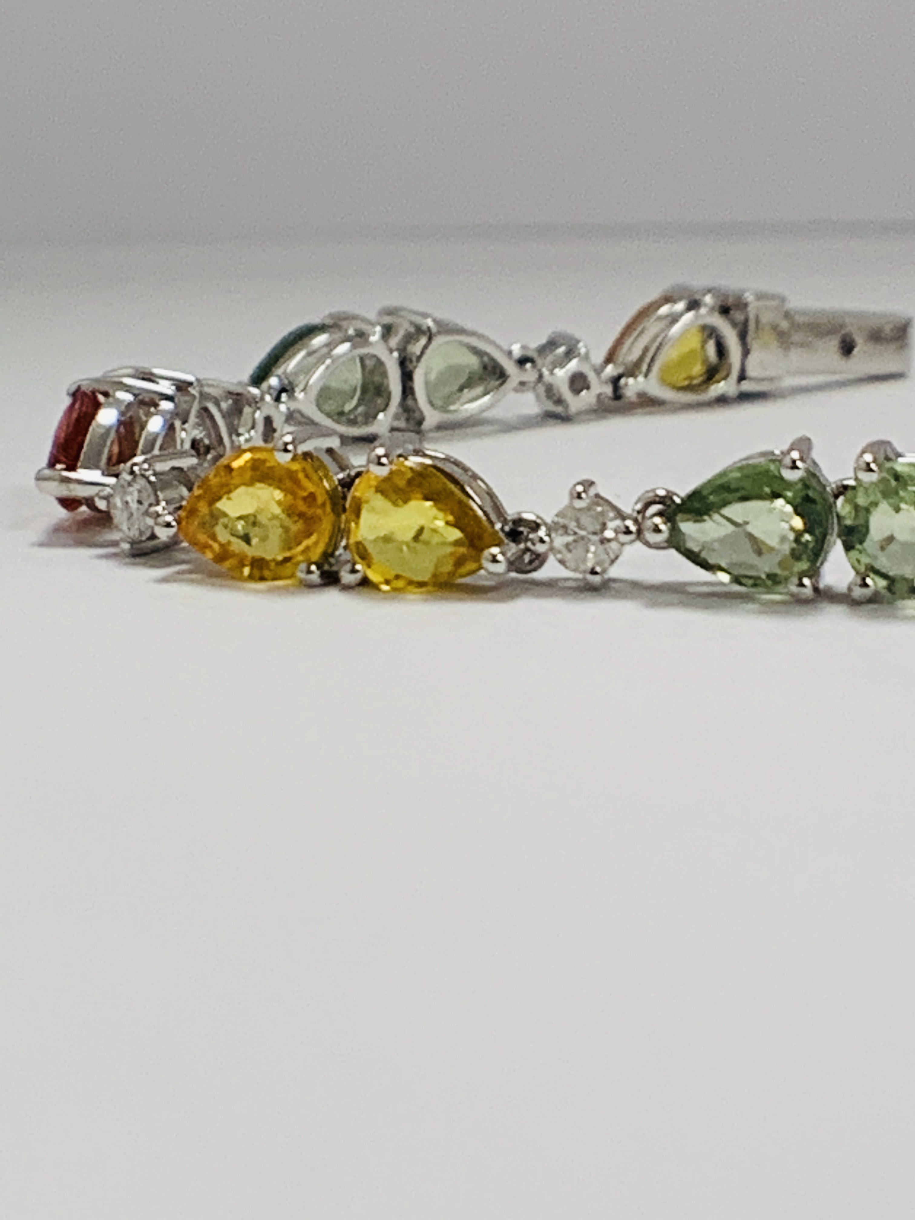 14ct White Gold Sapphire and Diamond bracelet featuring, 22 pear cut, yellow, green and orange Sapph - Image 3 of 24