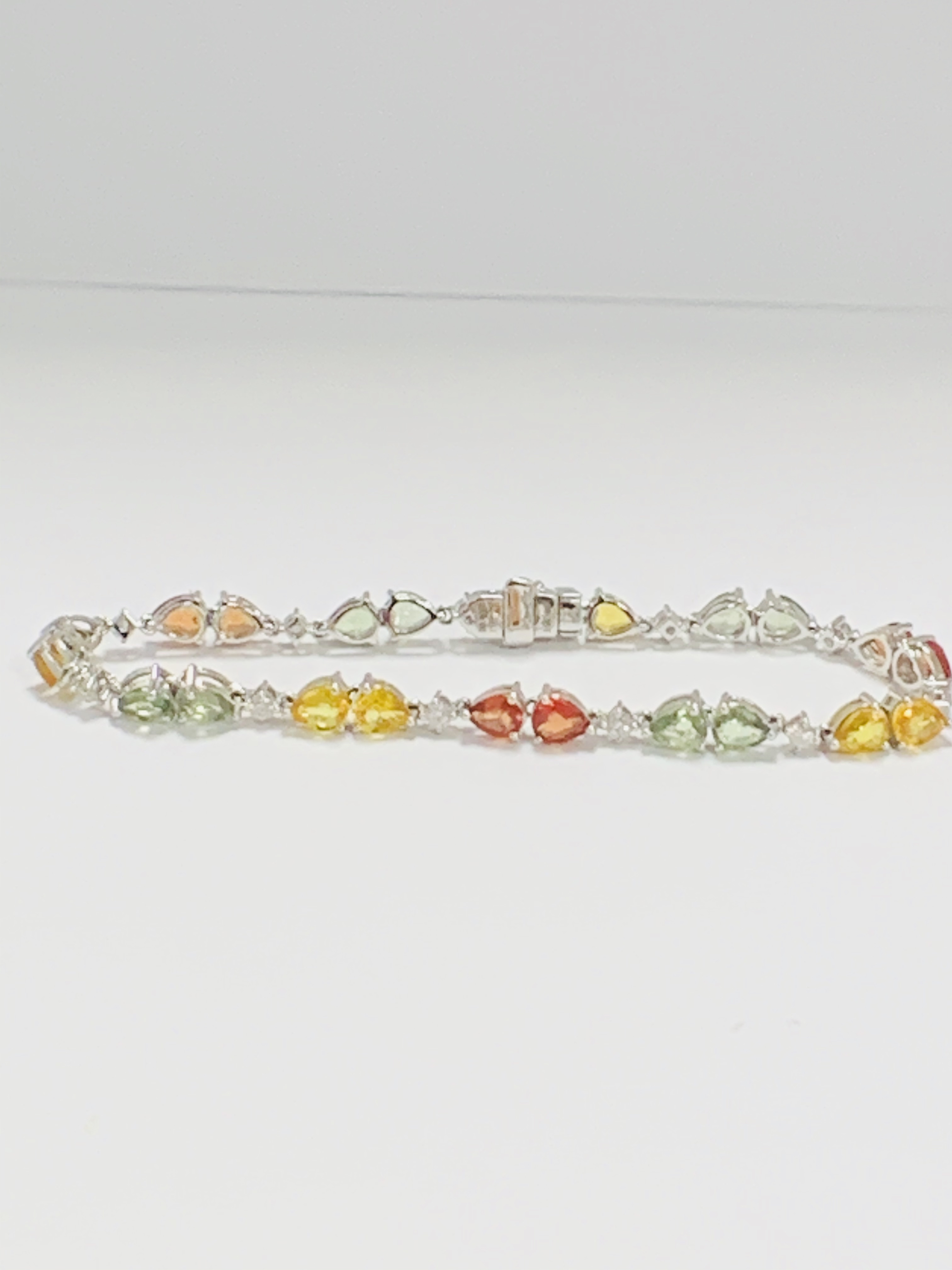 14ct White Gold Sapphire and Diamond bracelet featuring, 22 pear cut, yellow, green and orange Sapph - Image 13 of 24