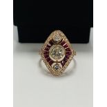 14ct Rose Gold Ruby and Diamond ring featuring centre, round brilliant cut Diamond (0.51ct), bezel s