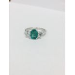 Platinum Emerald Diamond Three Stone Ring,