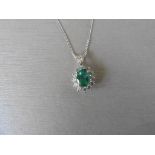 0.80Ct Emerald And Diamond Cluster Style Pendant.