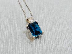 18Ct White Gold Blue Topaz And Diamond Pendant,