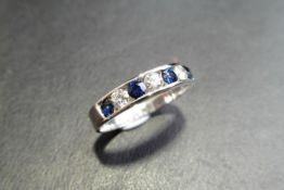 Sapphire And Diamond Eternity Band Ring Set In 9Ct White Gold.