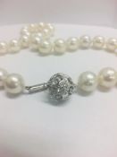 Strand 35 South Sea Pearls With 14Ct White Gold Filagree Style Ball Clasp.