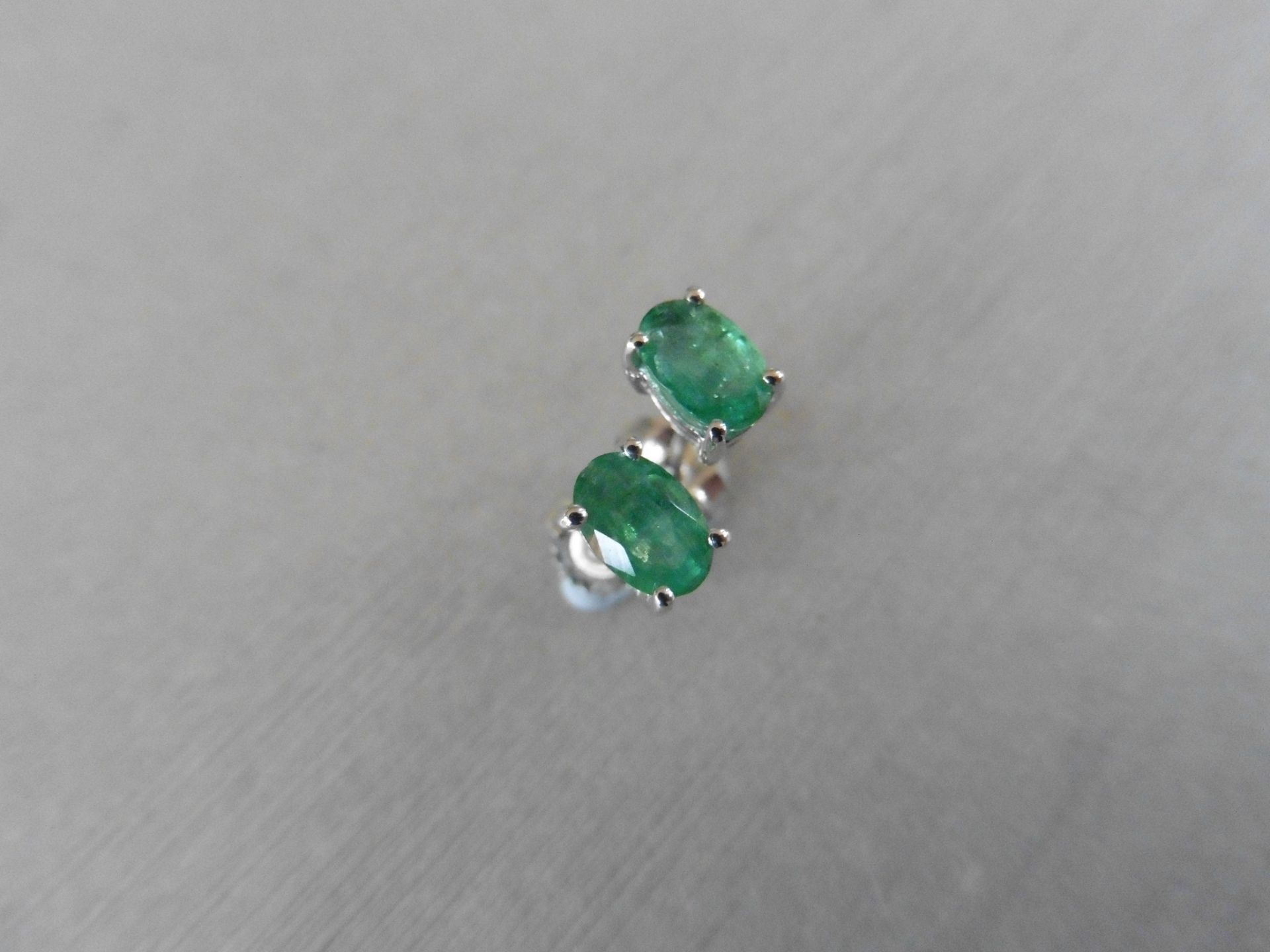 0.60Ct Emerald Stud Style Earrings Set In 9Ct White Gold.