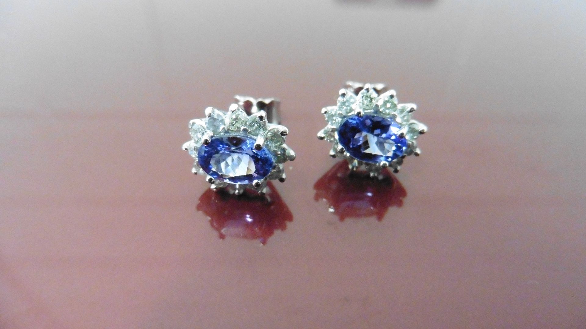 1.60Ct Tanzanite And Diamond Cluster Style Stud Earrings.
