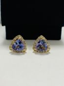 14ct Yellow Gold Tanzanite and Diamond stud earrings featuring, 2 trilliant cut, violet blue Tanzani