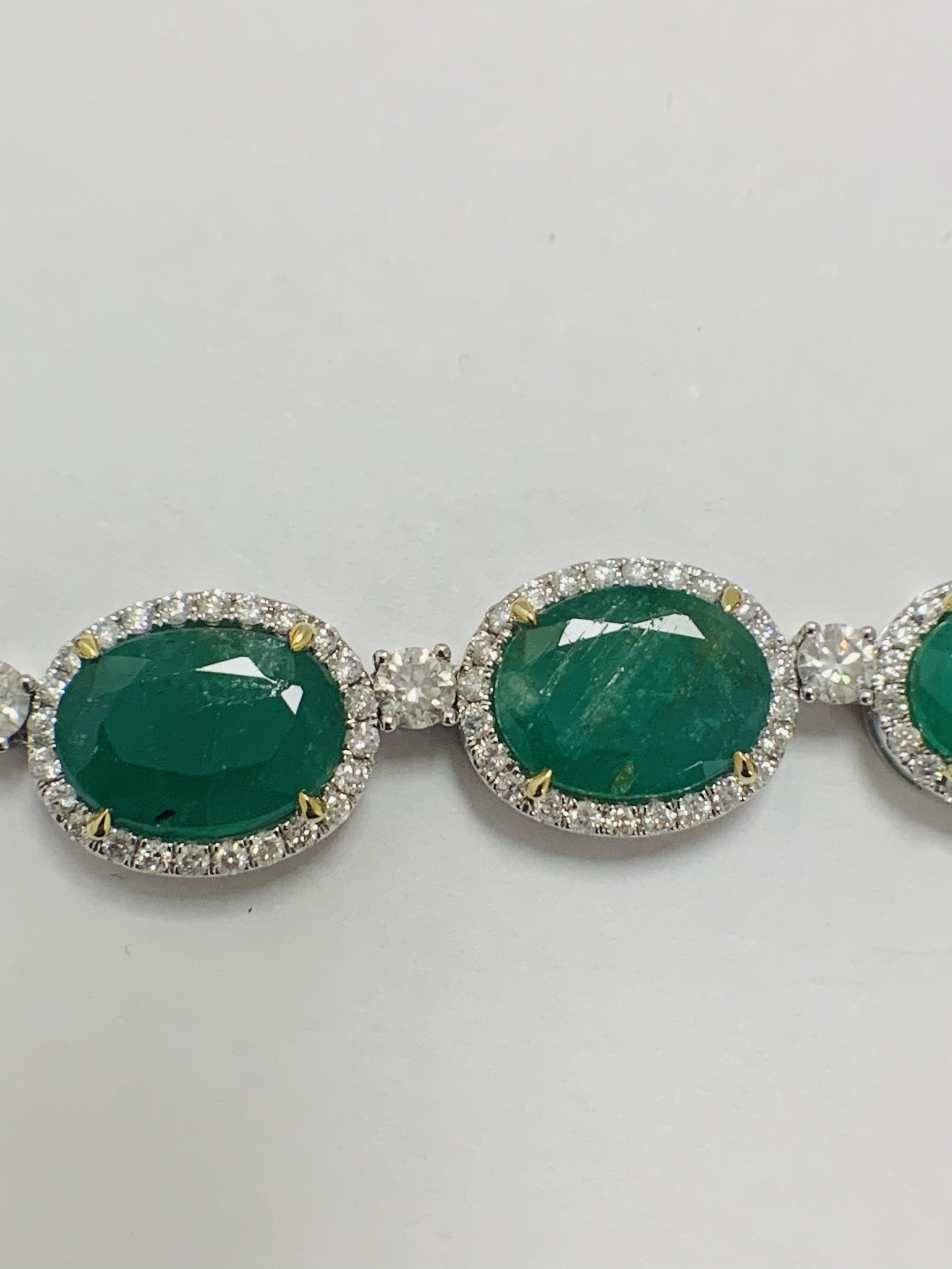 Platinum and Yellow Gold Emerald and Diamond necklace featuring, 29 oval cut, light to deep green Em - Image 20 of 36